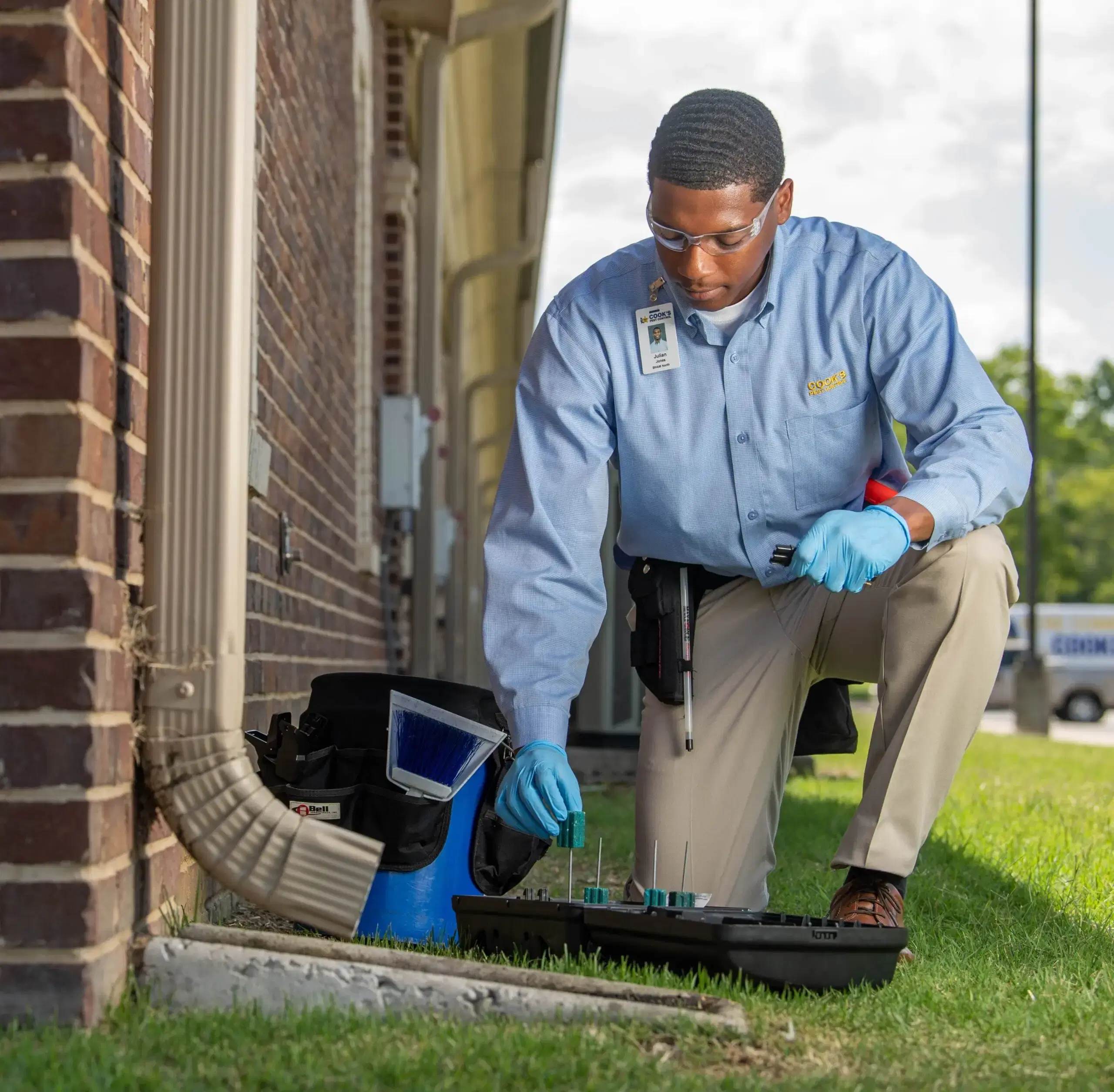 Cook's Pest control technician treating a residential home.